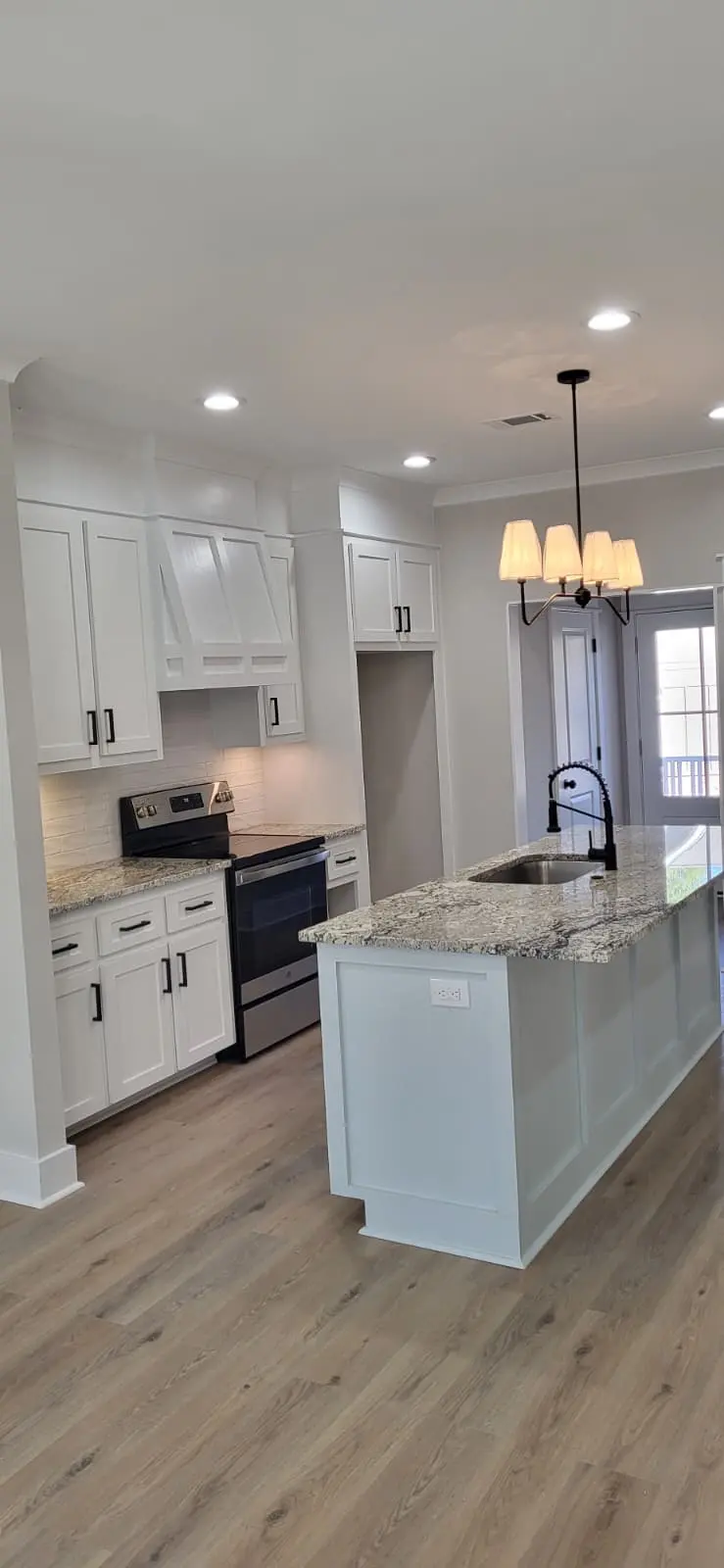 Finished kitchen remodel with custom cabinets and island in Hattiesburg, MS