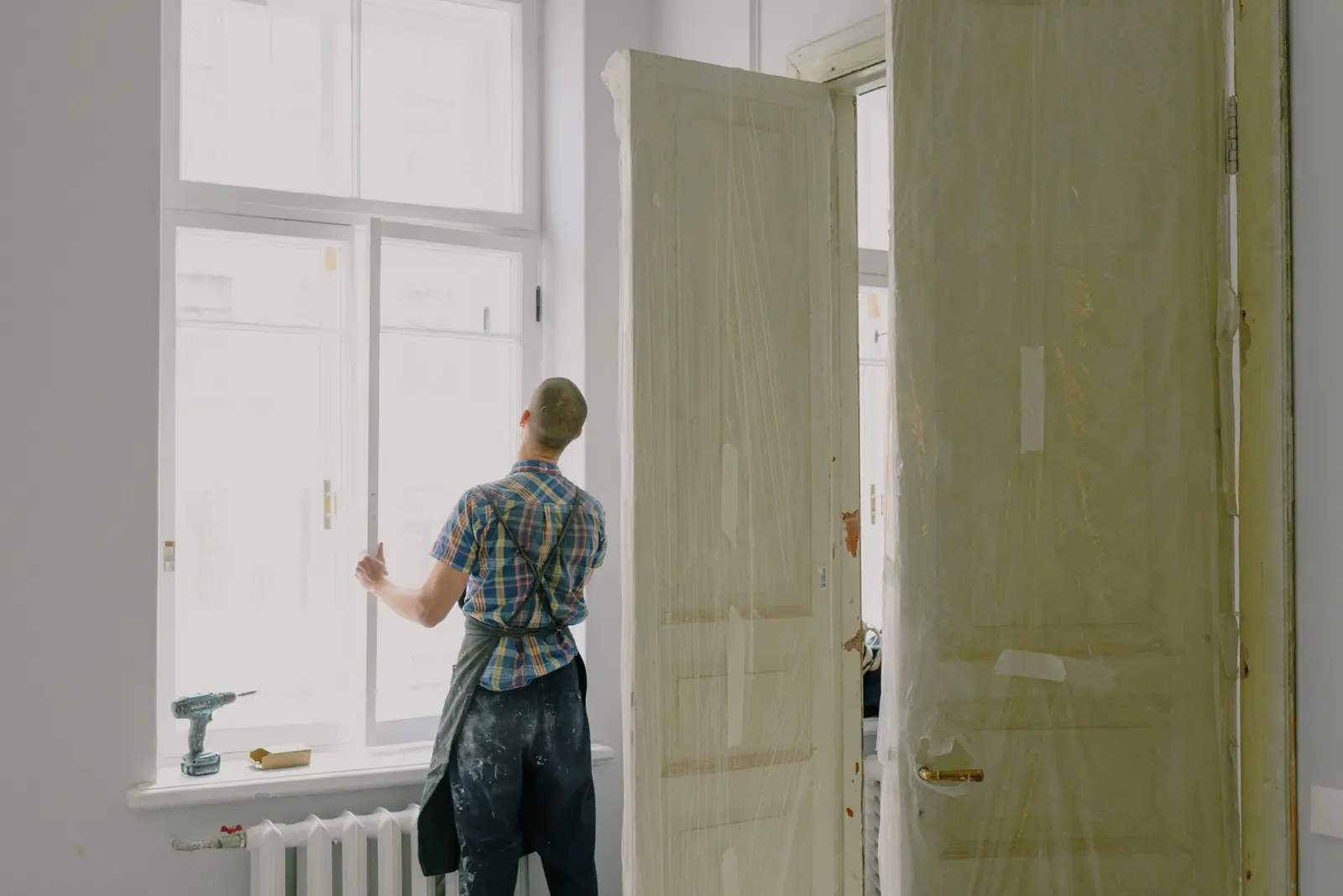 Contractor installing a door during a home renovation in Hattiesburg, MS