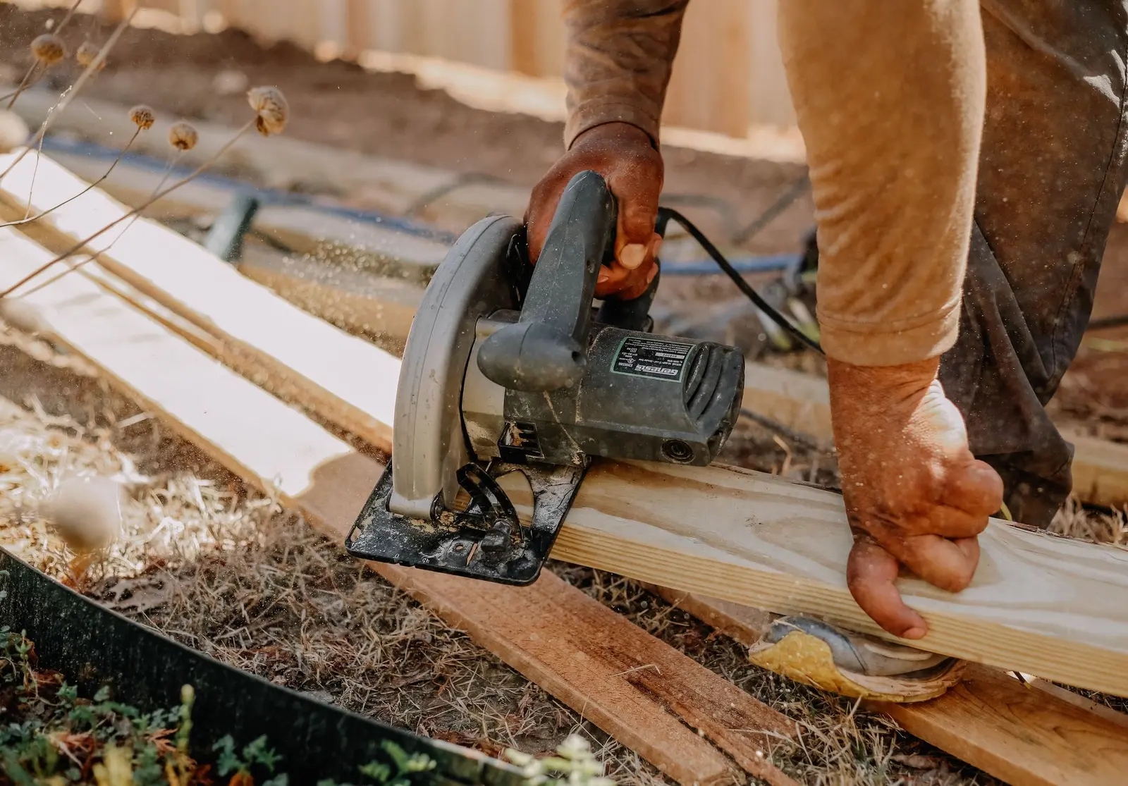Carpenter cutting trim lumber for a finish carpentry project in Hattiesburg, MS