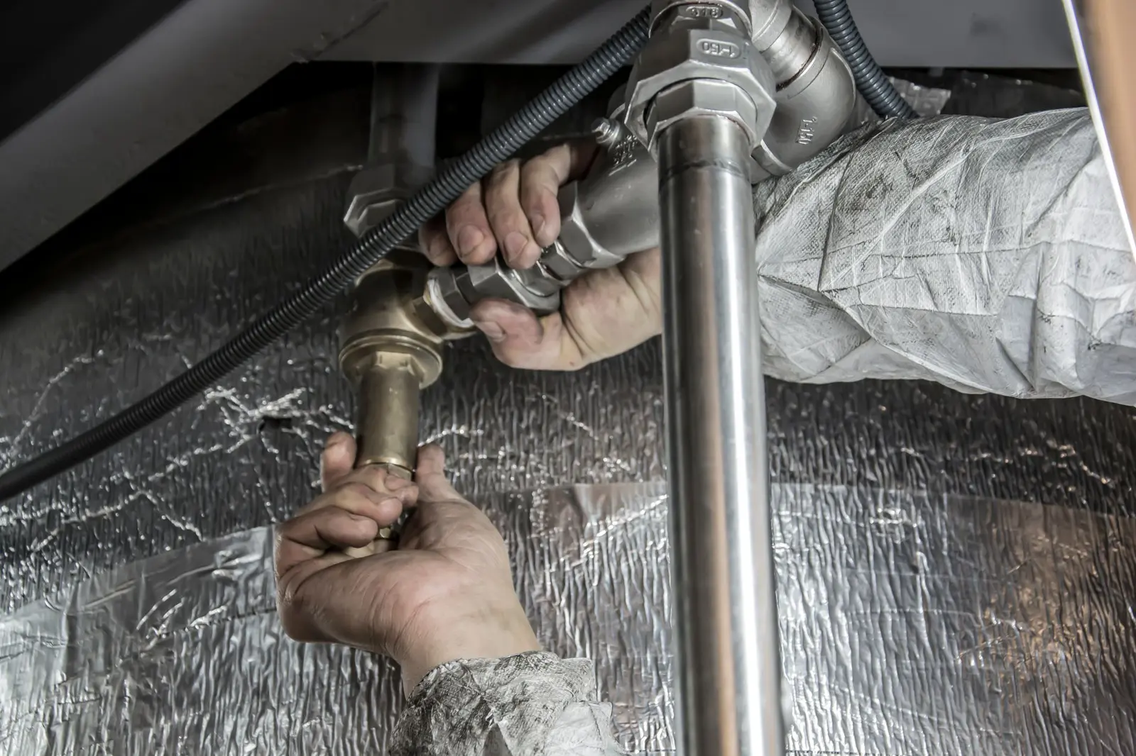 Plumbing repair under a sink, plumbing service in Hattiesburg, MS